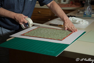 taping art to mat